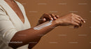 Woman Applying Sunscreen Lotion on Arm for Skin Protection