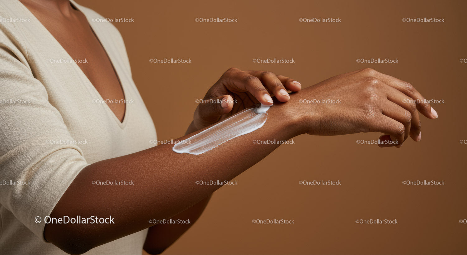 Woman Applying Sunscreen Lotion on Arm for Skin Protection