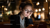 Businesswoman Using Smartphone at Night with City Lights Background