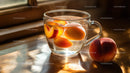 Peach Infused Water in Glass Cup on Wooden Table