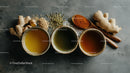 Herbal Tea Ingredients with Fresh Ginger and Turmeric on Dark Surface
