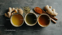 Herbal Tea Ingredients with Fresh Ginger and Turmeric on Dark Surface