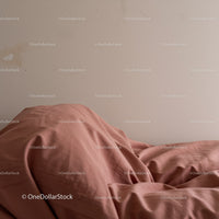 Dusty Pink Bed Linen with Soft Fabric Texture in Cozy Bedroom