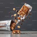 Chocolate Nut Protein Bar Breaking with Ingredients Flying