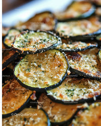 Close-up of Grilled Eggplant Slices Garnished with Herbs