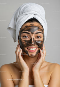 Young Woman Applying Facial Mask for Skincare and Beauty