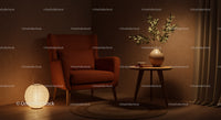 Cozy armchair with vase and glowing lamp in warm corner
