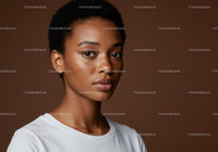 Elegant Portrait of a Young Woman with Freckles and Short Curly Hair
