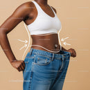 Close-up of Woman Measuring Waist with Jeans for Body Transformation
