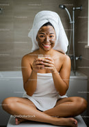 Joyful Woman Relaxing with Facial Mask in Spa Bathroom