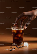 Hand Reaching for Iced Coffee with Coffee Beans Nearby