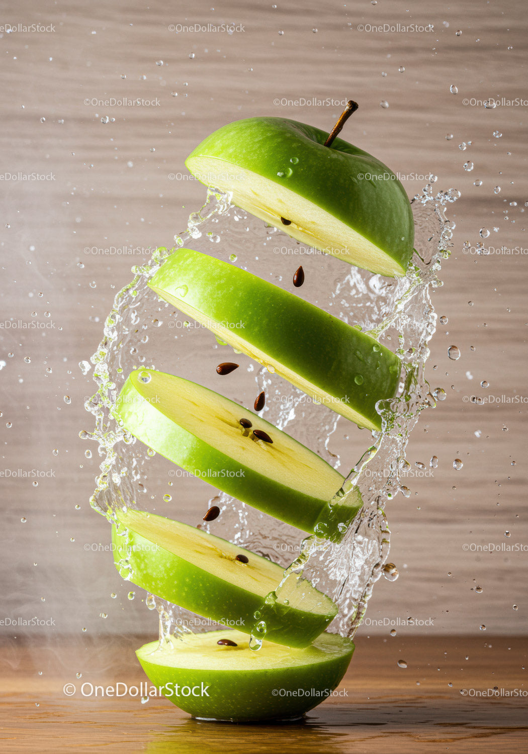 Sliced green apple floating with water splash