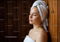 Relaxing Woman with Towel Wrap and Skincare in Spa Setting