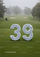 Golf course with large numbers made of golf balls