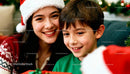 Smiling woman and boy enjoying Christmas moments together