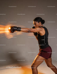 Female athlete delivering a powerful boxing punch