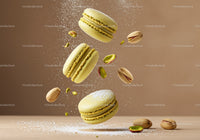 Yellow pistachio macarons with powdered sugar splash