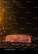 Close-up of juicy steak cooking on hot grill