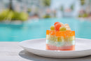 Vibrant Fruit Jelly with Grapes and Peaches on White Plate