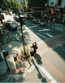 Urban Crosswalk Scene with Pedestrians and Parked Cars