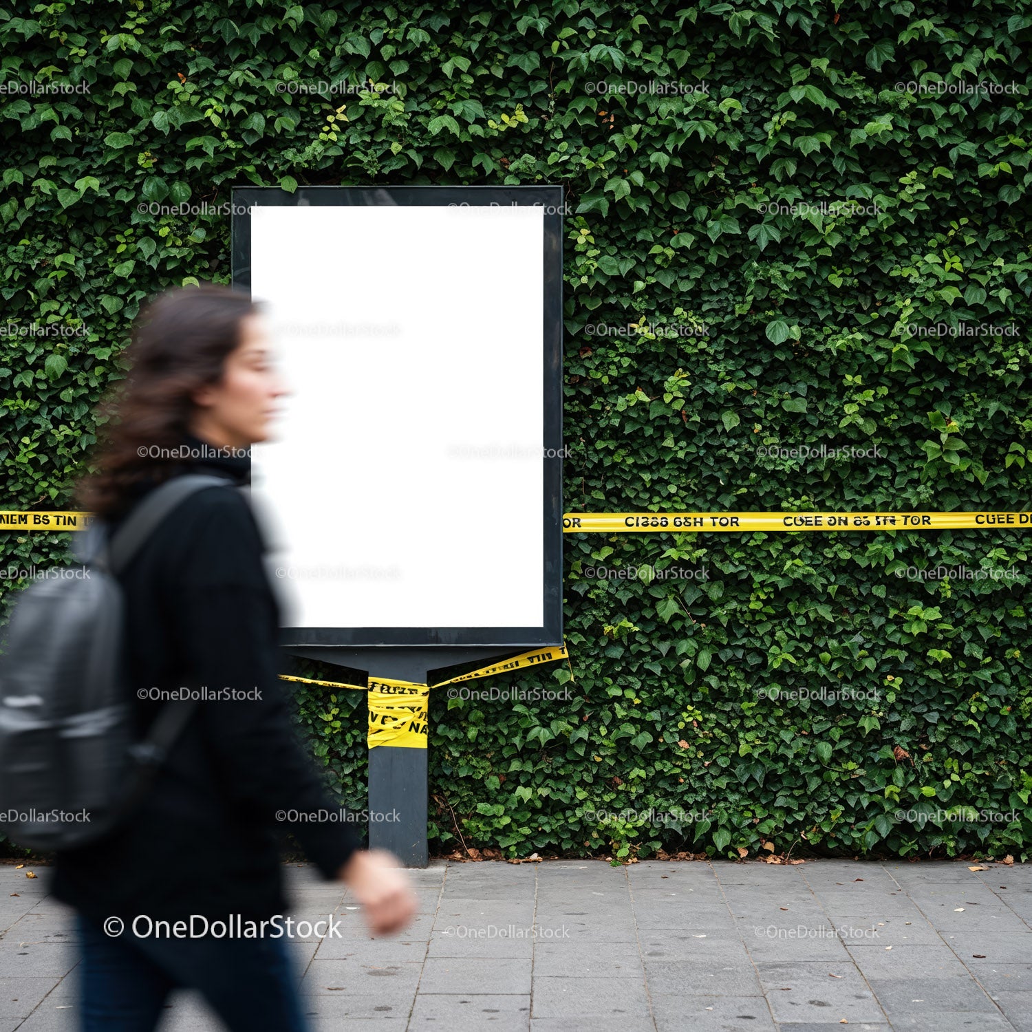 Blurred woman walking past empty billboard with caution tape
