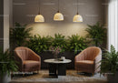 Cozy sitting area with plush chairs and lush greenery