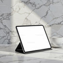 Modern tablet on marble table with coffee cup