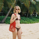 Woman in Bikini with Red Tote Bag on Tropical Beach with Palm Trees