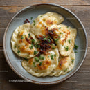 Traditional Potato Pierogi with Bacon and Parsley on Rustic Plate