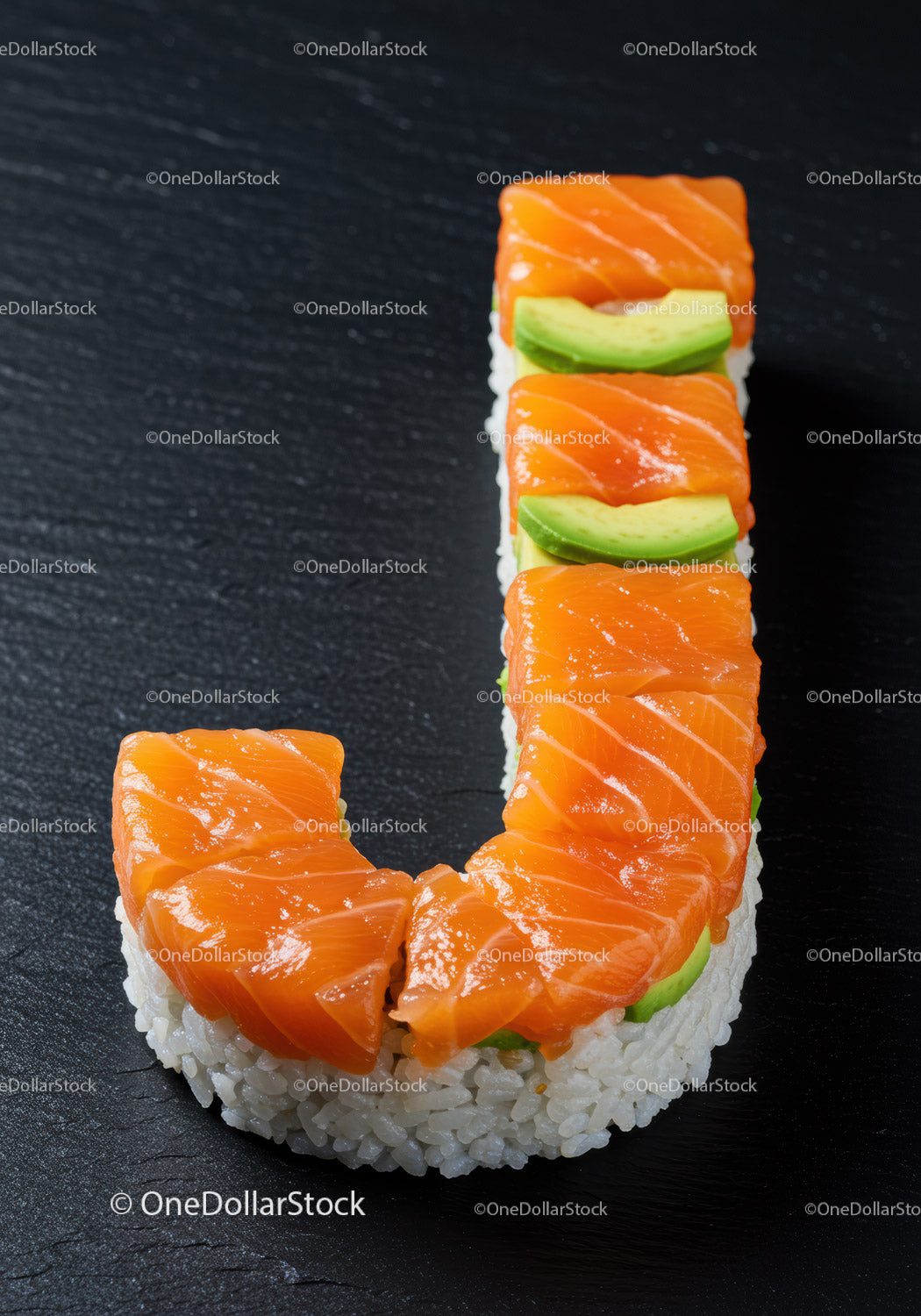 Sushi shaped like letter J with salmon and avocado