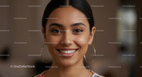 Young Woman with Radiant Smile and Stylish Earrings