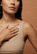 Close-Up of a Woman Applying Moisturizer on Shoulder for Healthy Skin