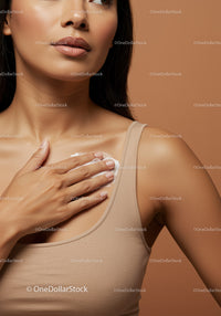 Close-Up of a Woman Applying Moisturizer on Shoulder for Healthy Skin