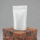 Plain white resealable pouch on brick pedestal