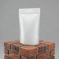 Plain white resealable pouch on brick pedestal