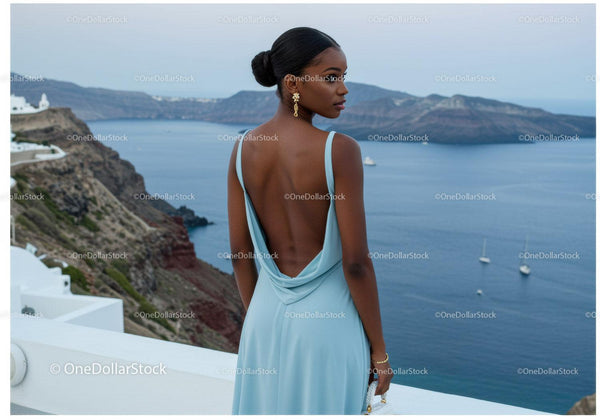Elegant Woman in Blue Dress Overlooking Sea View