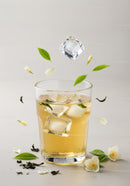 Refreshing Iced Jasmine Tea with Floating Leaves and Flowers