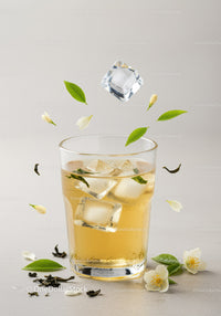 Refreshing Iced Jasmine Tea with Floating Leaves and Flowers