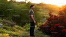 Man enjoying peaceful nature during golden hour