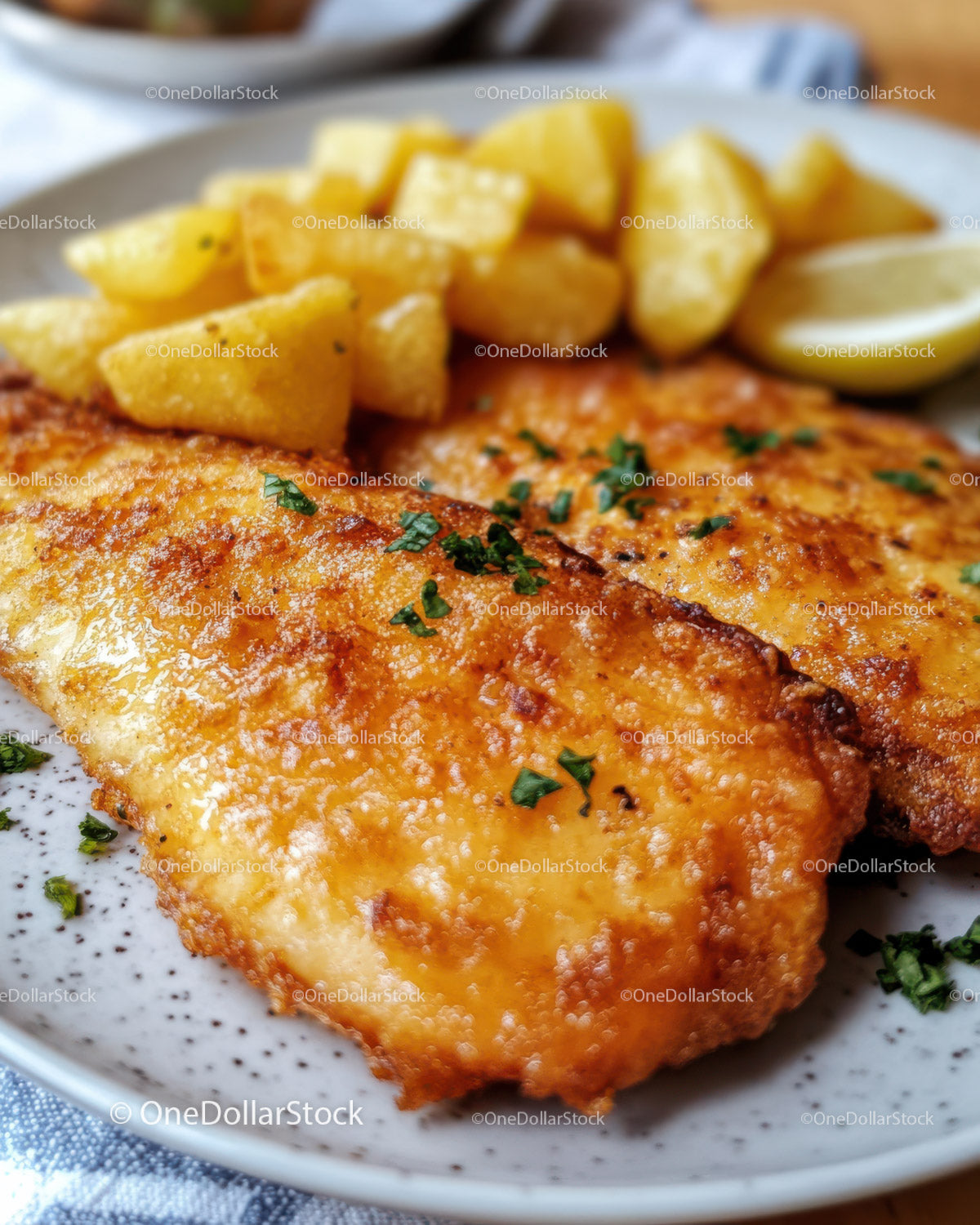 Crispy Fish Fillet with Potato Fries and Lemon Wedges