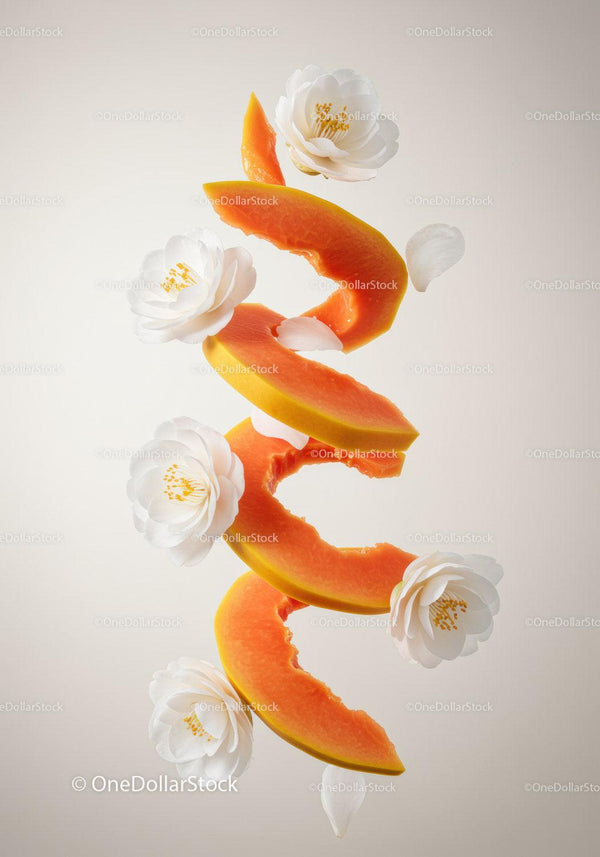 Floating papaya slices with delicate white flowers