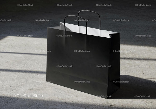 Minimalist Black Shopping Bag on Concrete Floor JPG Mockup Image