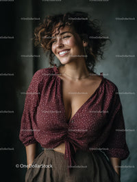 Fashionable Woman Smiling with Curly Hair in Casual Burgundy Top