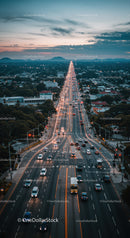 City Highway at Dusk with Moving Traffic and Sunset Sky