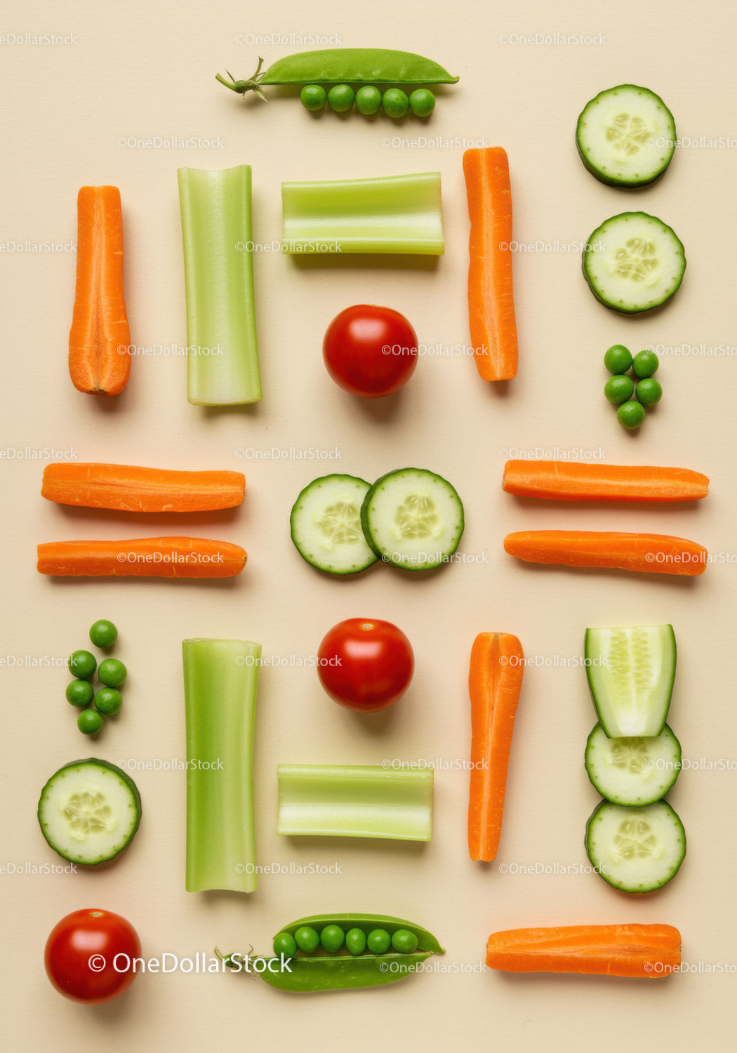 Fresh mixed vegetables arranged on beige background