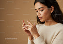 Elegant Young Woman Using Smartphone in Cozy Indoor Setting