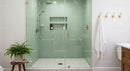 Modern bathroom with glass shower and green tiles