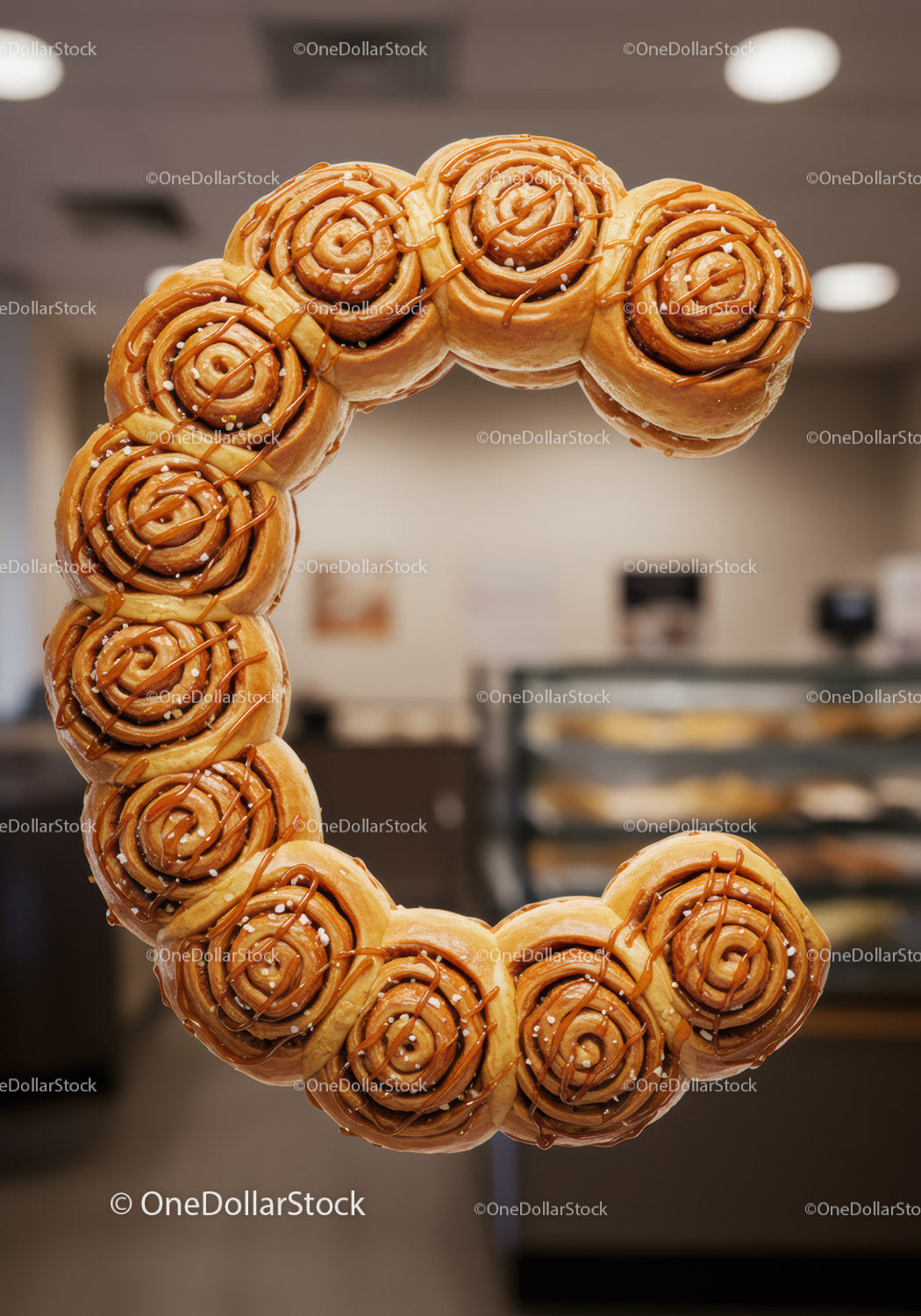 Circular arrangement of sweet cinnamon rolls with sugar crystals