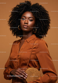 Elegant African American Woman with Curly Hair Wearing Brown Blouse and Wicker Bag