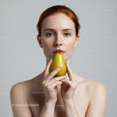 Elegant Woman Holding Yellow Pear in Minimalistic Portrait